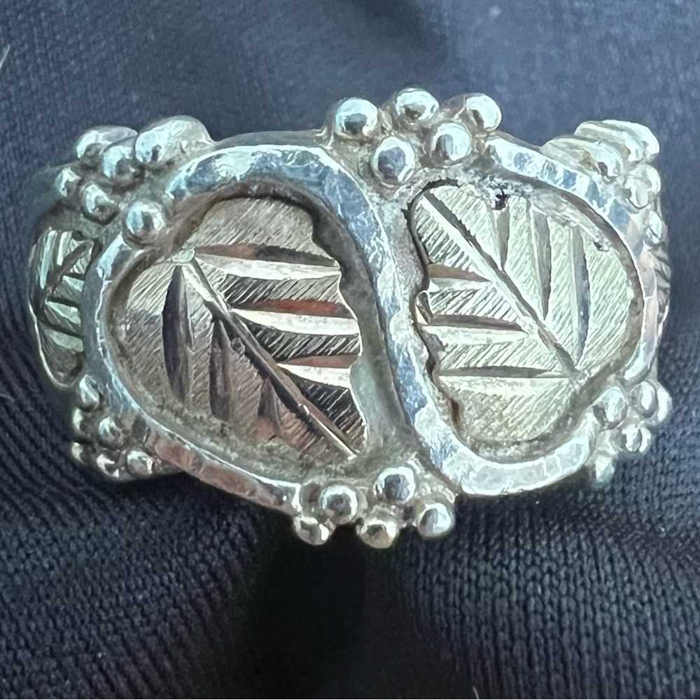 Silver ring with gold leaf in lay about a size 6-61/2